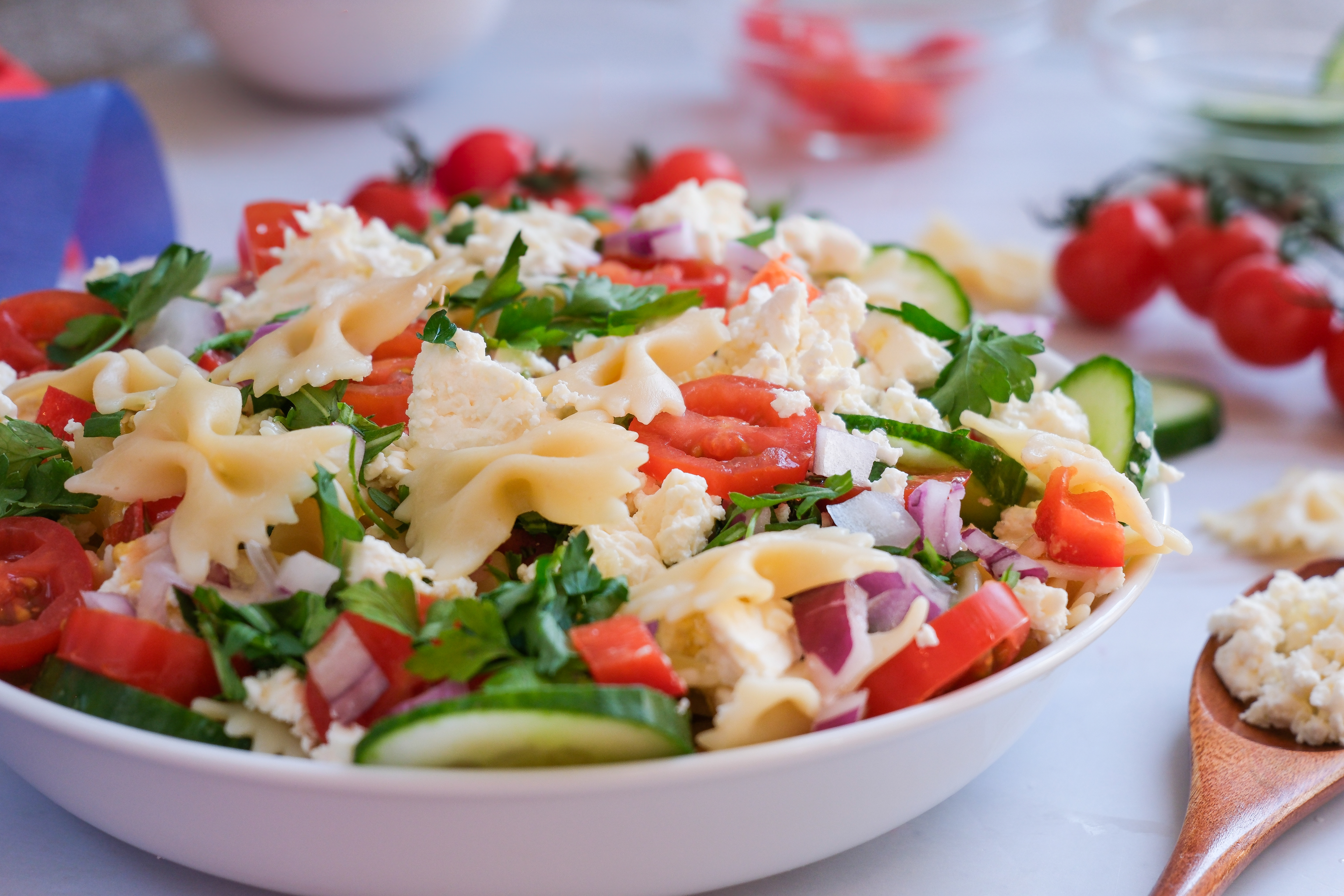 Pasta Salad shown from the side in a white dish.